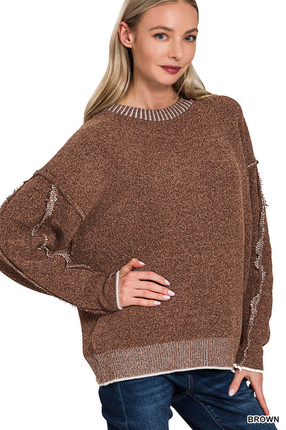 Exposed seam round neck sweater