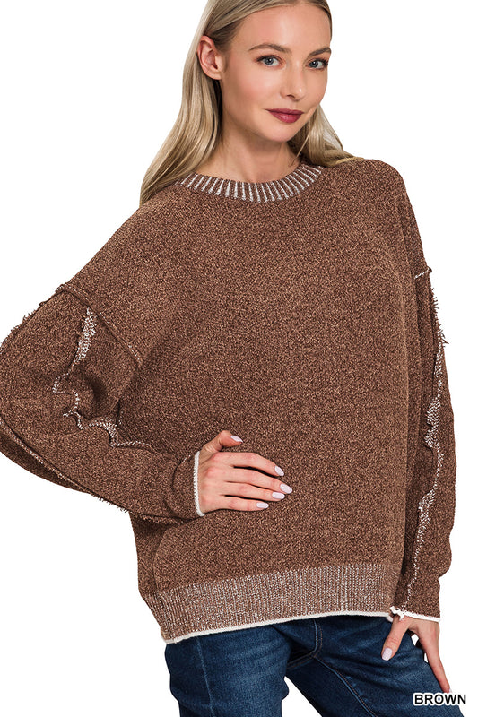 Exposed seam round neck sweater