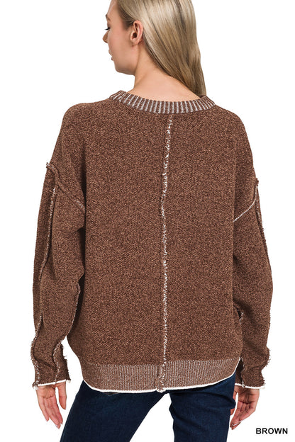 Exposed seam round neck sweater